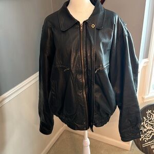 100% Black Leather Exterior minimal signs of wear, considering its age.